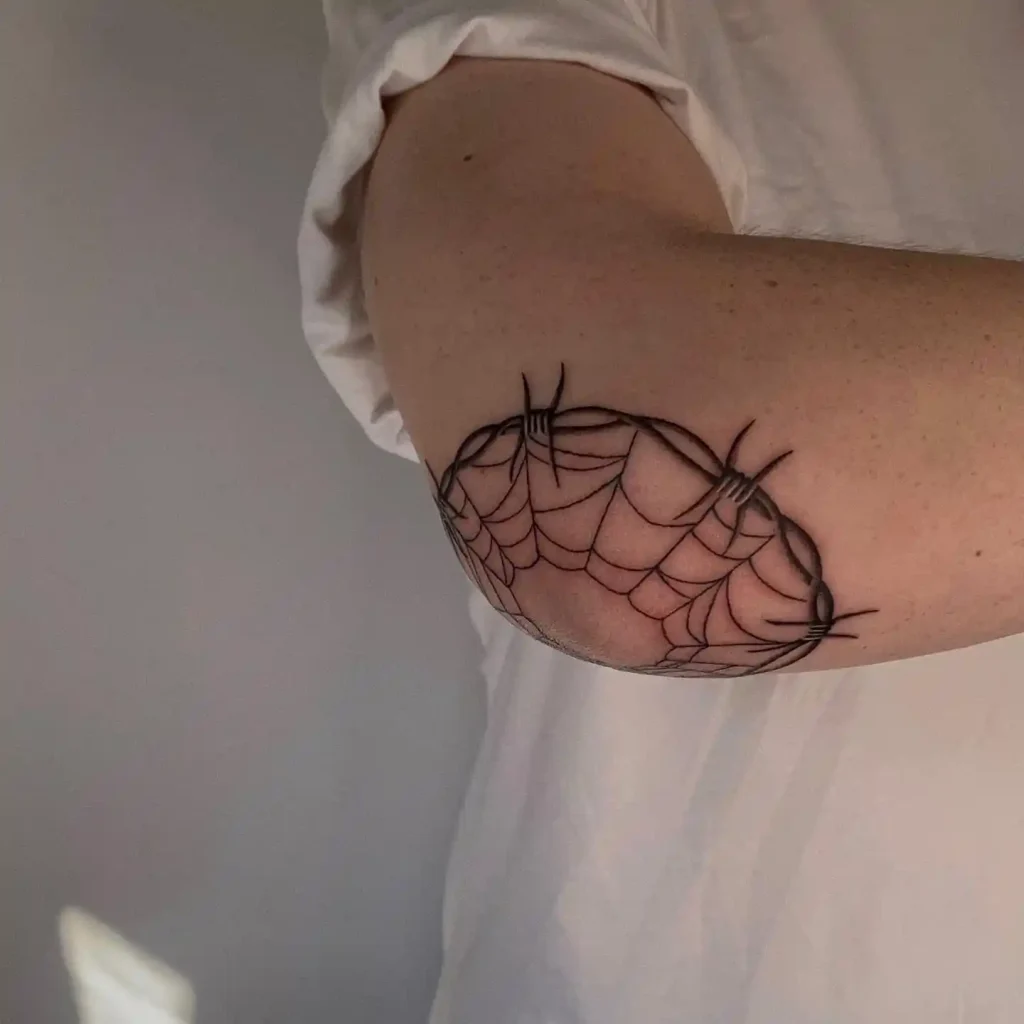 Spider Web and Barbed Wire on Elbow
