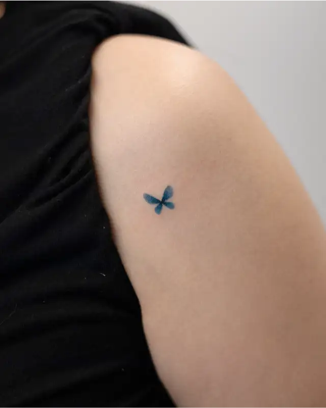 Tiny Blue Butterfly Minimal Tattoo