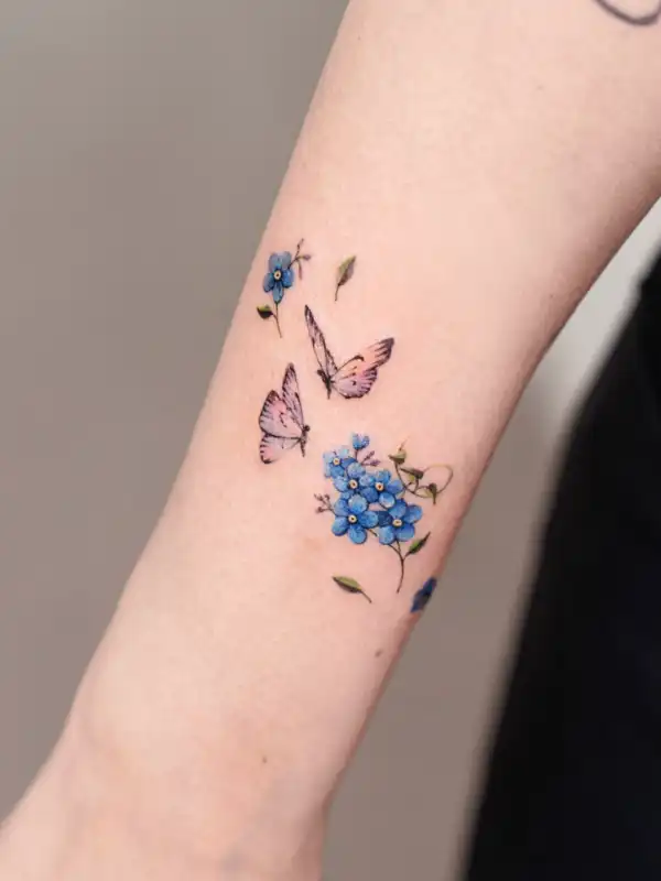 Tiny Butterfly and Forget-Me-Not Tattoo
