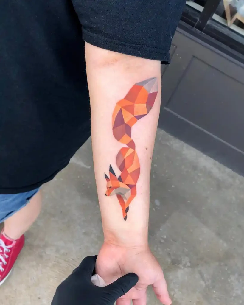Vibrant Geometric Fox in Motion on Forearm
