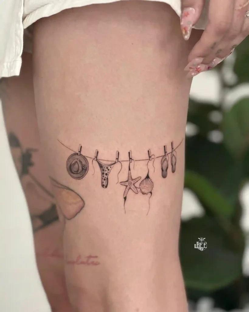 Beach Day Essentials on Clothesline on Thigh