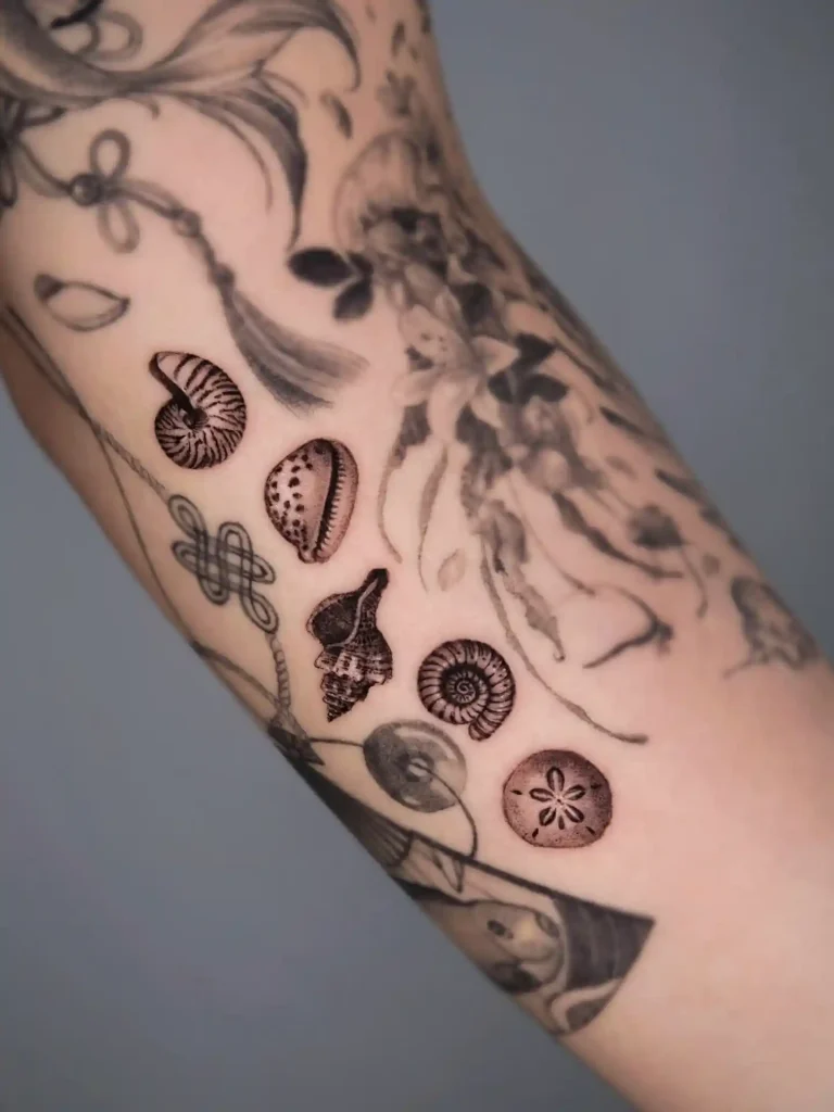 Collection of Miniature Sea Treasures on Upper Arm