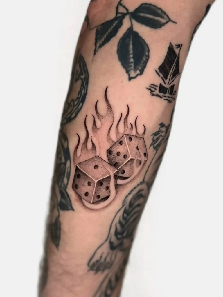 Flaming Black and Gray Dice on Forearm