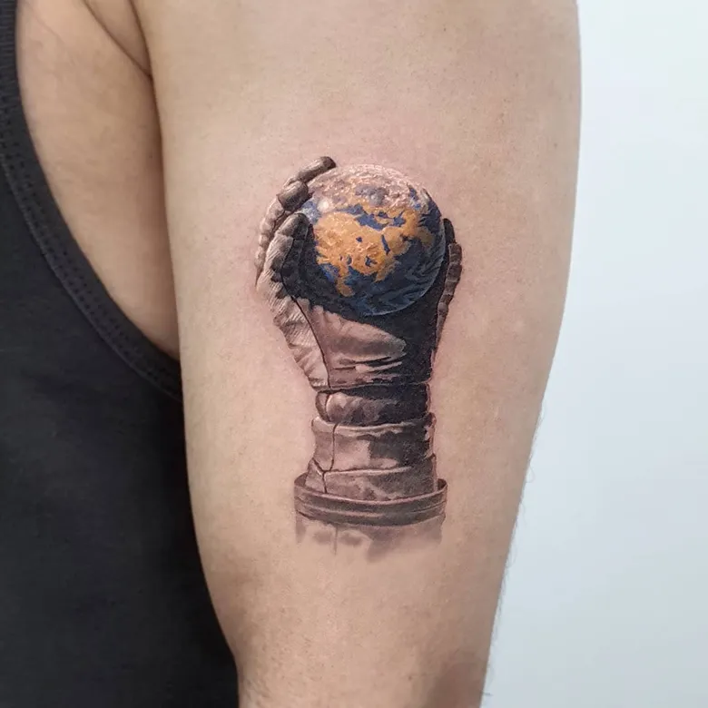 Hand Holding the World Realism Globe Tattoo