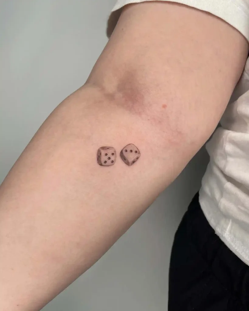 Micro Minimalist Pair of Dice on Forearm