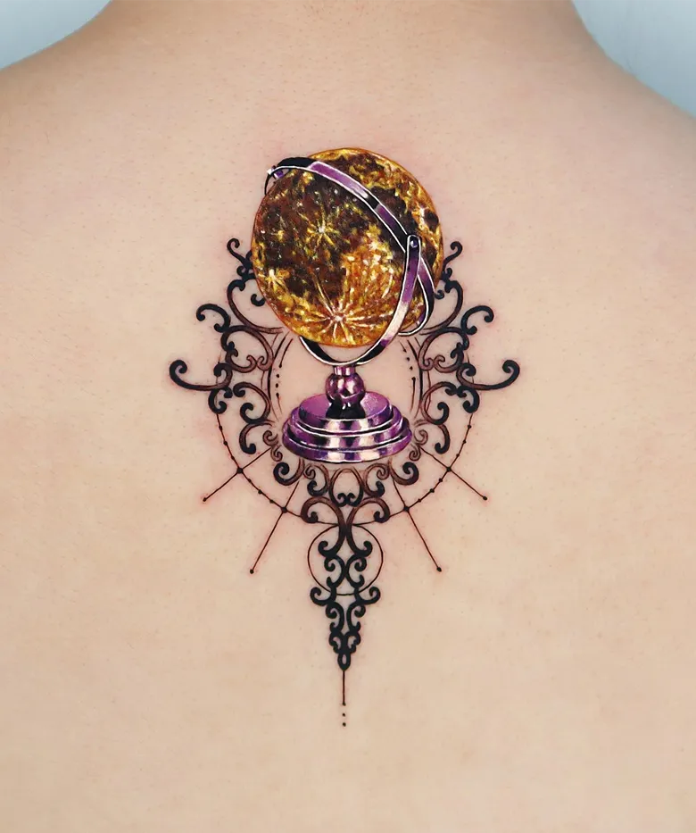 Ornate Golden Globe Mandala Tattoo