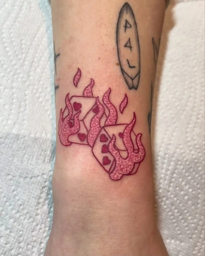 Pink Flaming Dice on Wrist