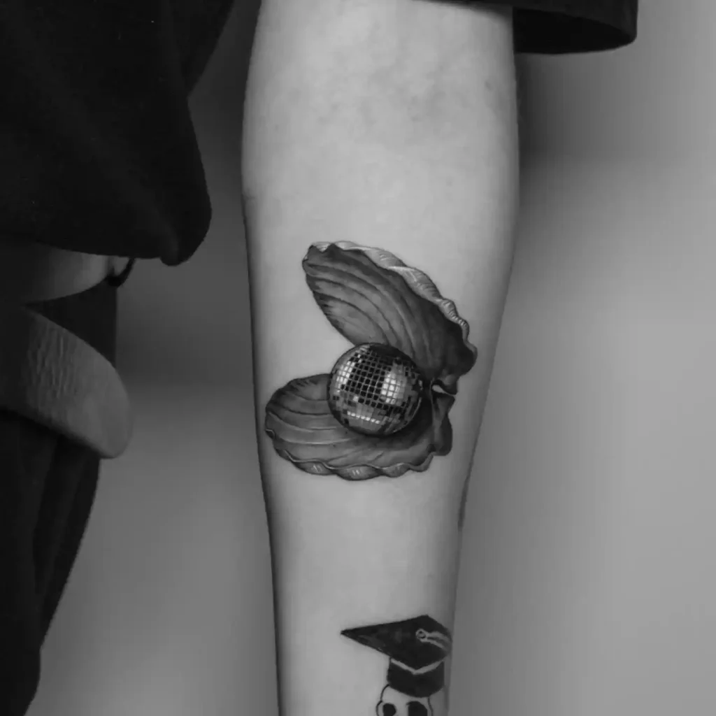 Surreal Disco Ball Pearl in Scallop on Forearm