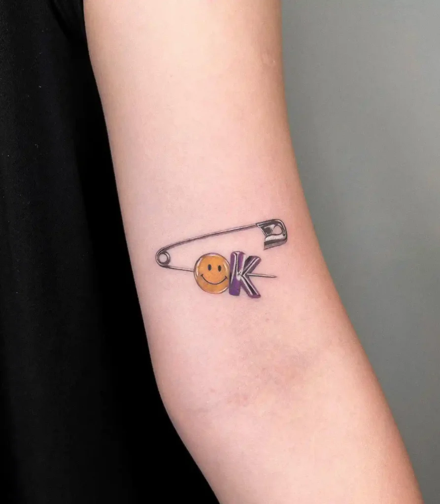 Tiny Safety Pin OK Smile on Forearm