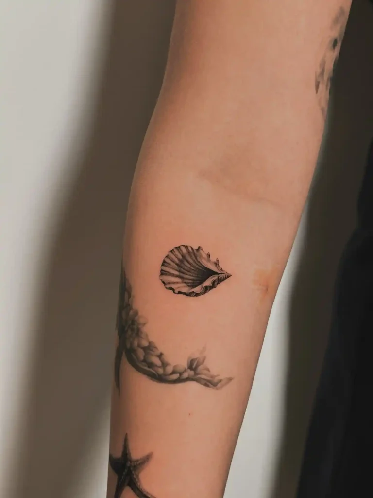 Tiny Scallop Shell Silhouette on Inner Wrist