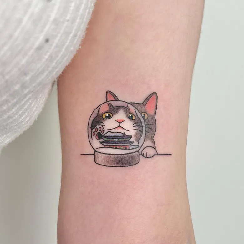Whimsical Cat & Snow Globe Tattoo