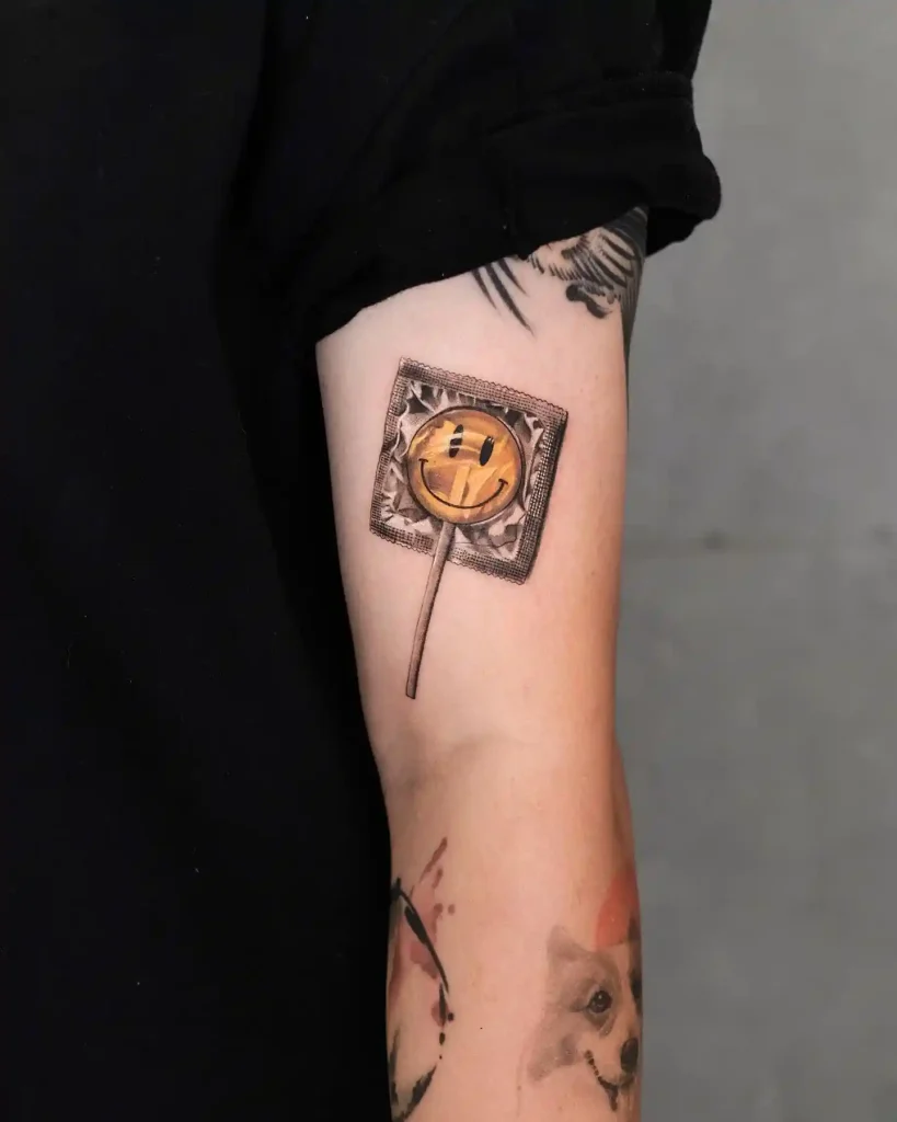 Wrapped Smiley Face Lollipop on Inner Arm