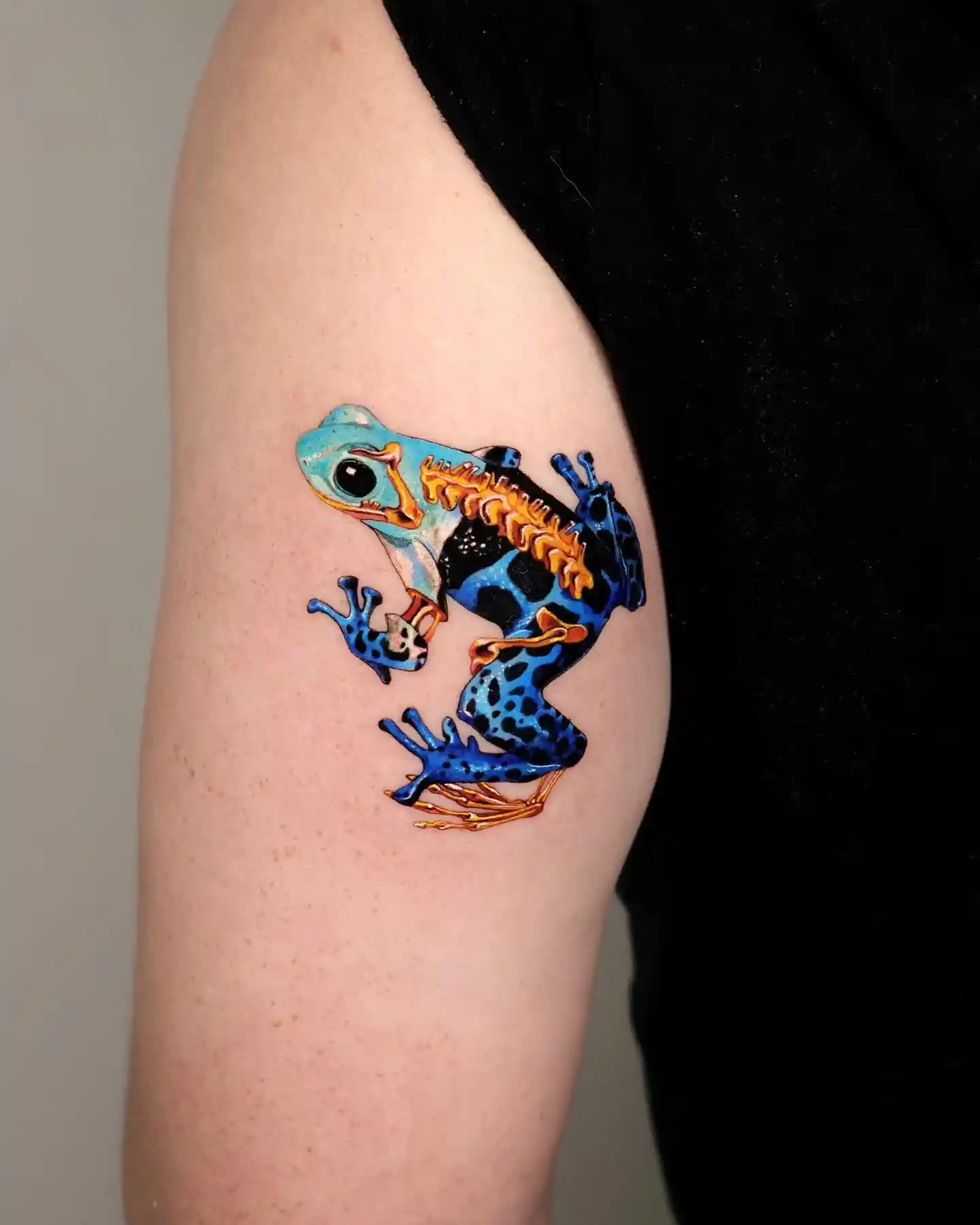Blue Poison Dart Frog Tattoo on Upper Arm
