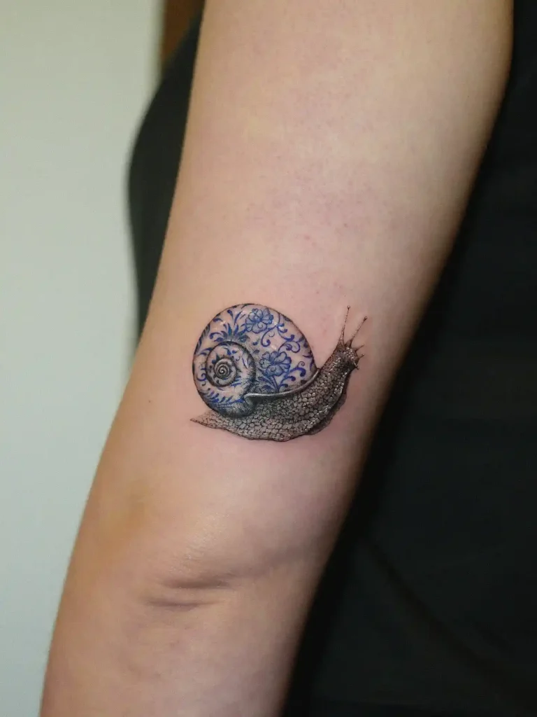 Blue Porcelain Snail on Inner Forearm