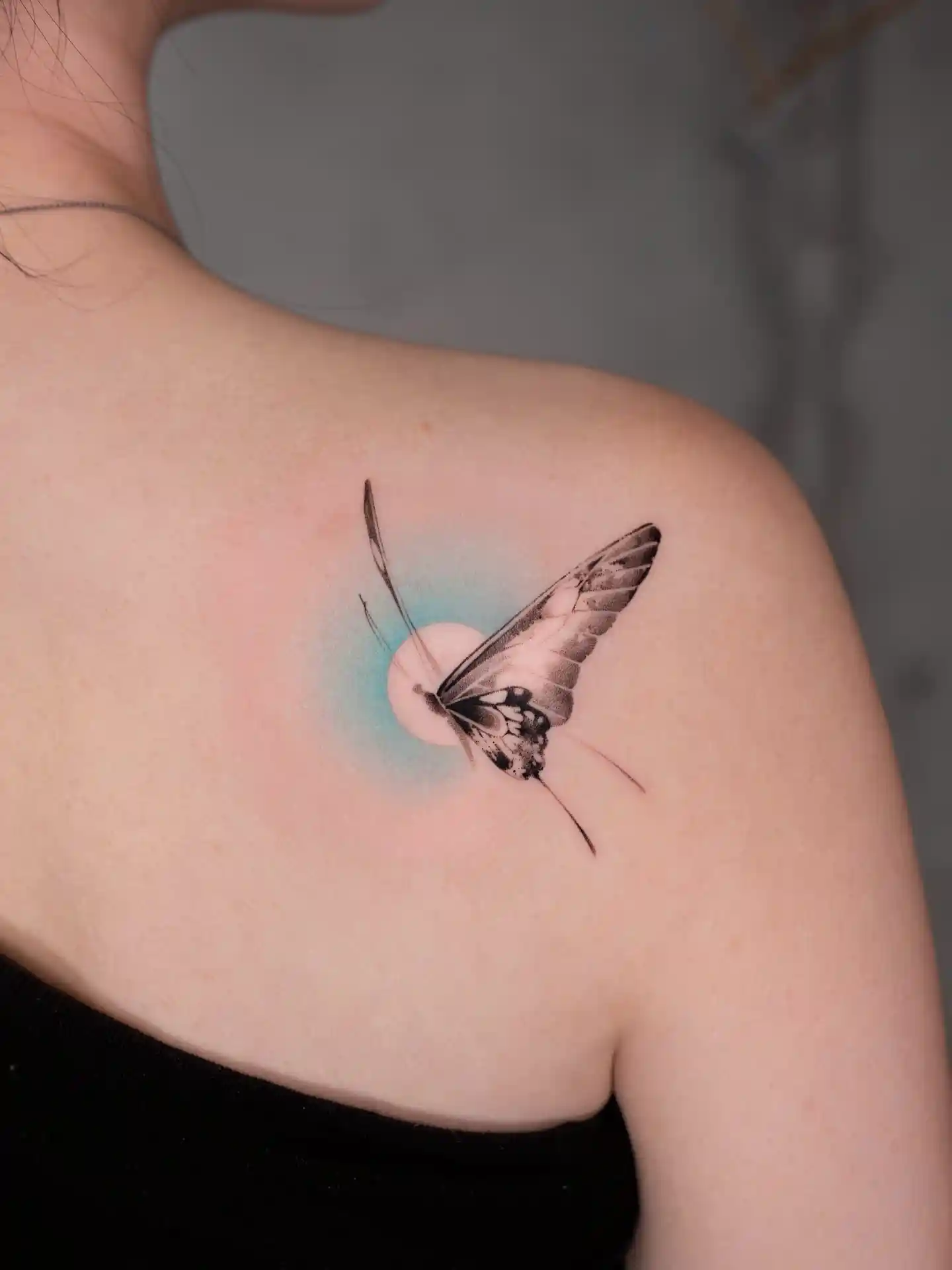 Butterfly with Blue Glow on Shoulder