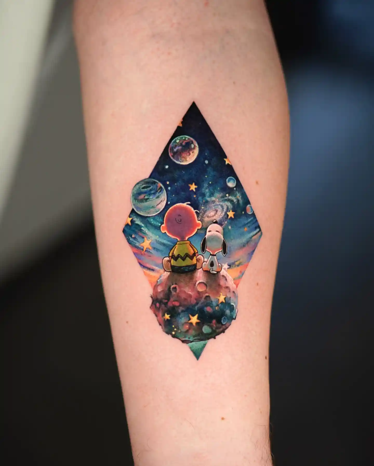 Charlie Brown and Snoopy Space Scene on Inner Forearm