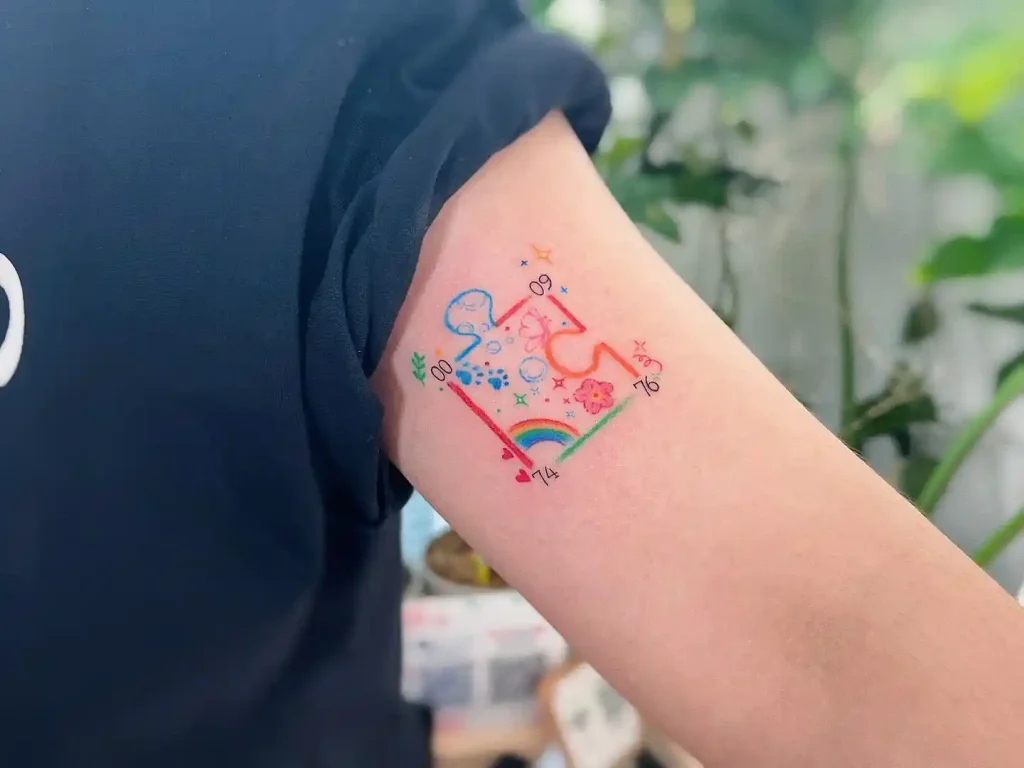 Colorful Childhood Doodles on Upper Arm
