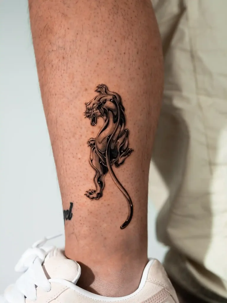Glossy Black Panther on Lower Leg