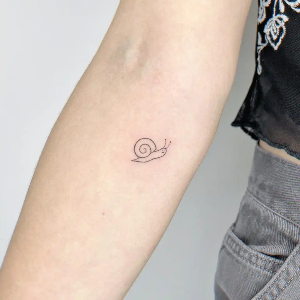 Minimalist Happy Snail on Inner Forearm