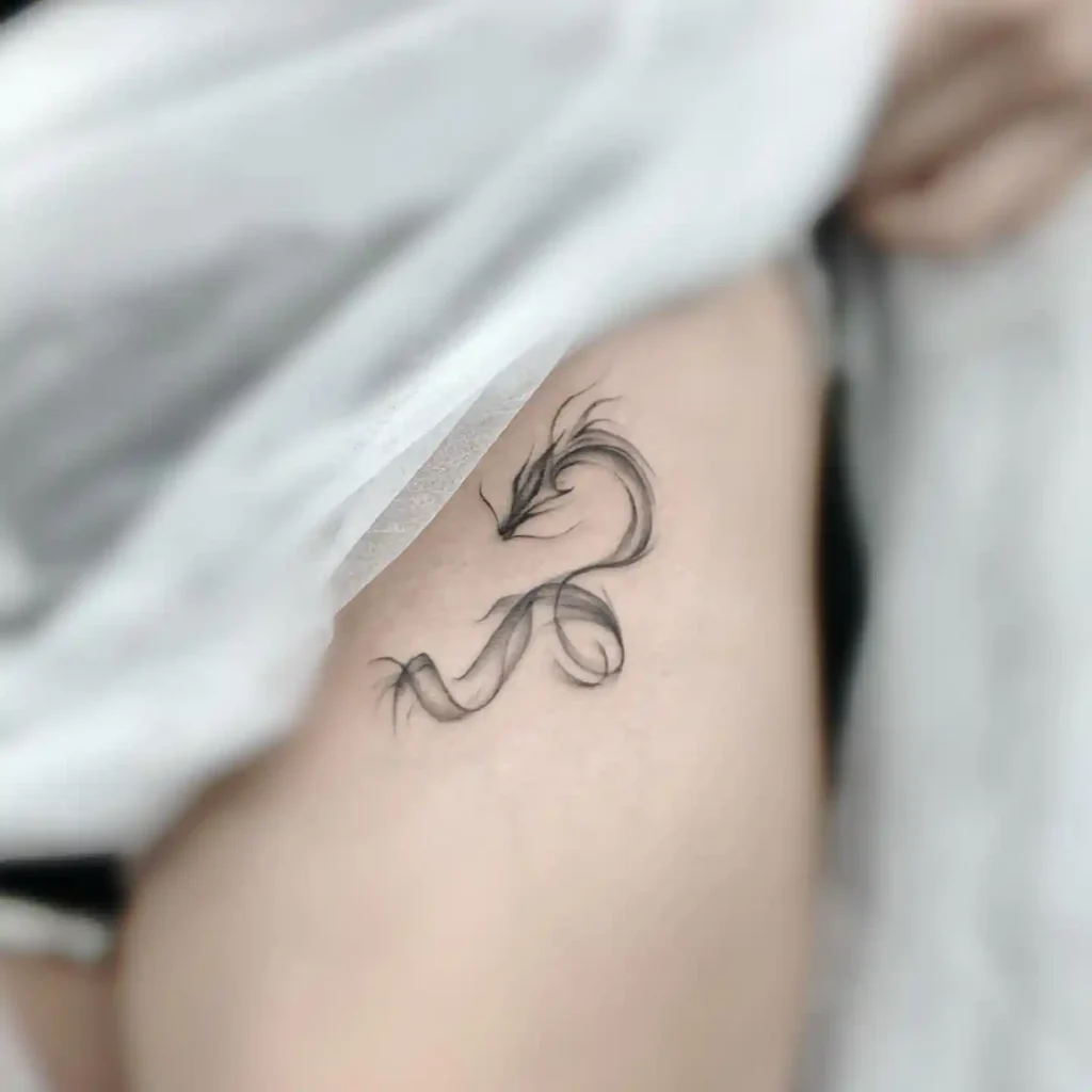 Minimalist Smoke Dragon on Thigh