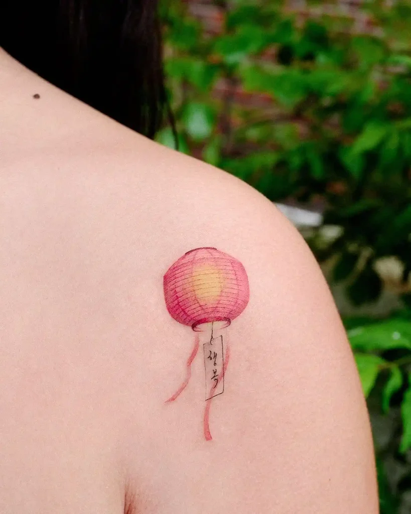 Pink Paper Sky Lantern on Shoulder
