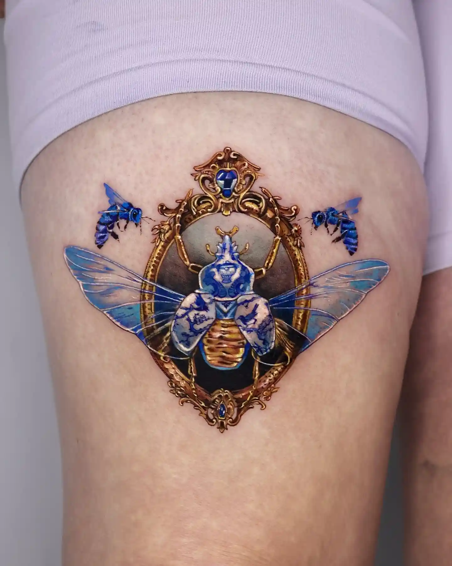 Porcelain Beetle in Golden Frame on Thigh
