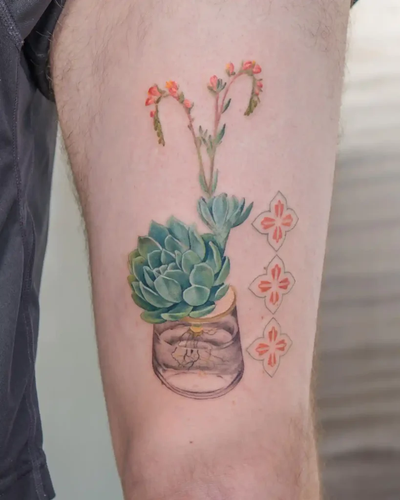 Potted Succulent and Flowers on Upper Arm