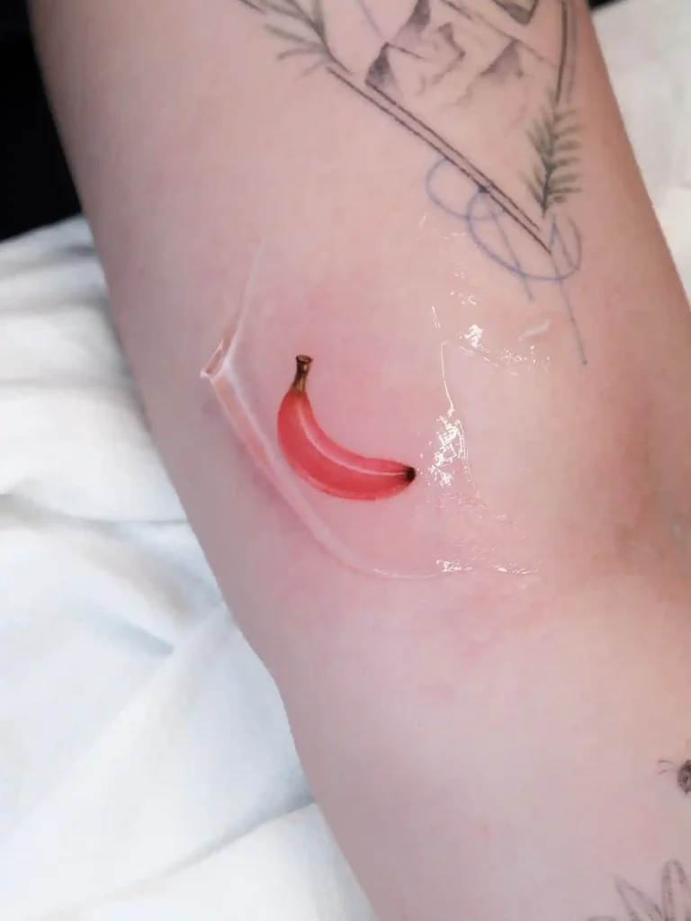 Realistic Pink Banana Design on Inner Arm