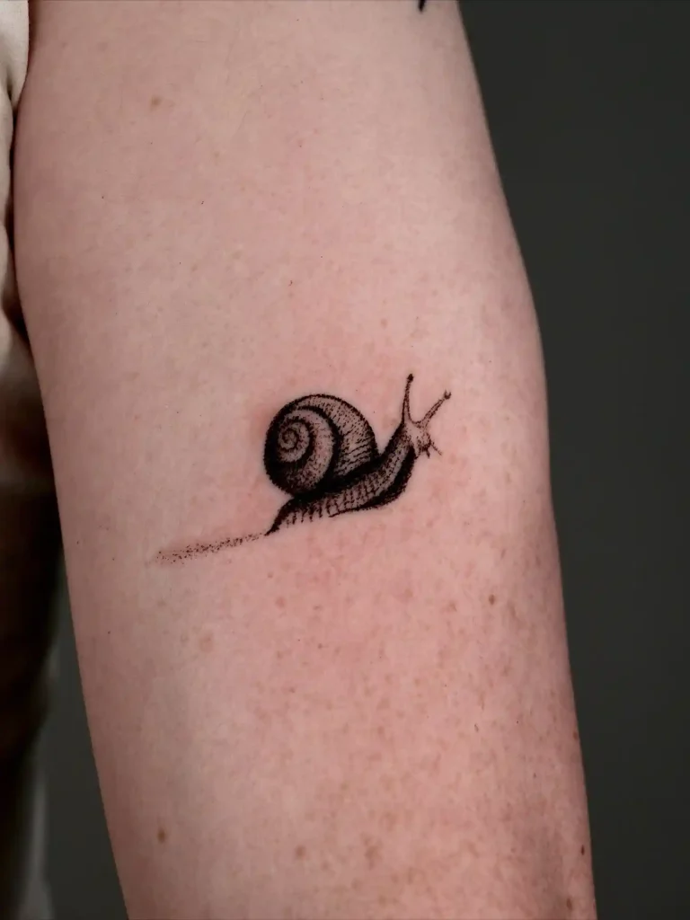 Realistic Snail Illustration on Inner Arm