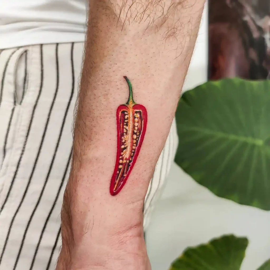 Sliced Red Chili Pepper on Forearm