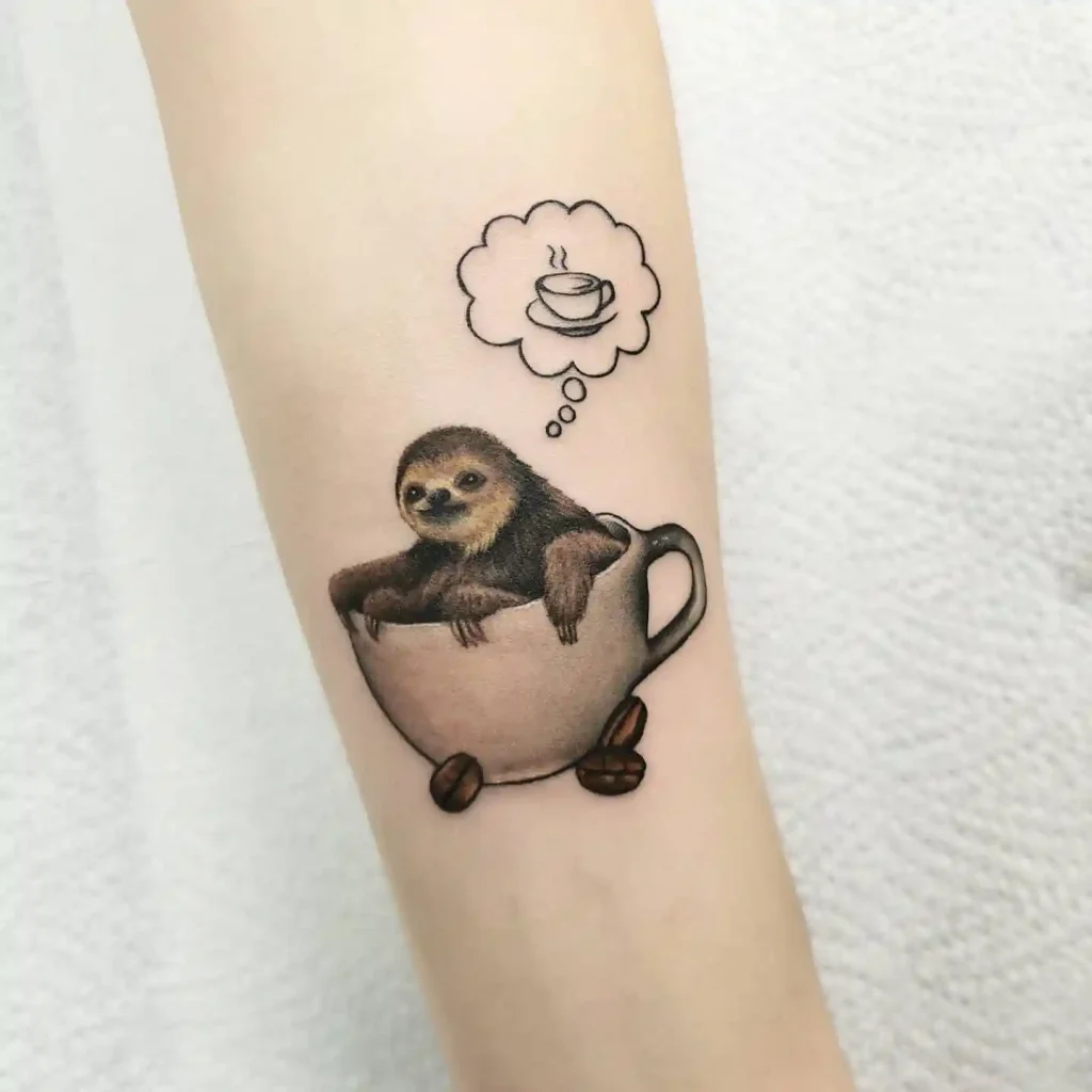 Sloth in Coffee Cup Tattoo on Forearm