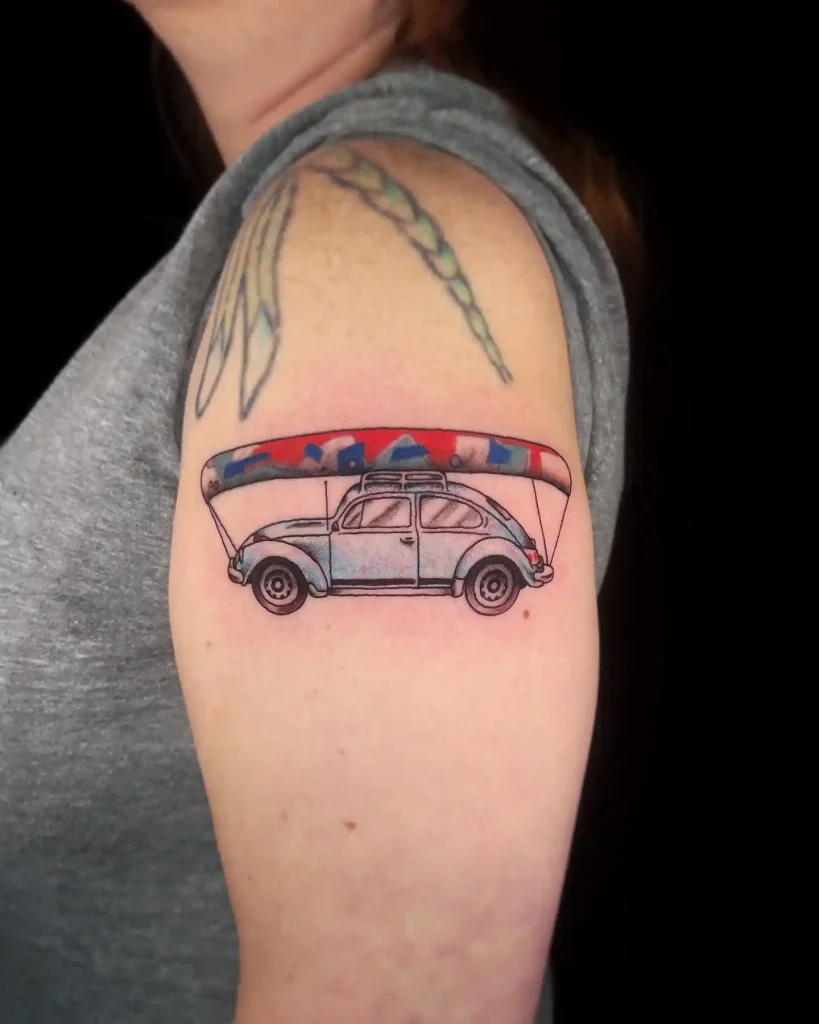 VW Beetle with Canoe on Upper Arm