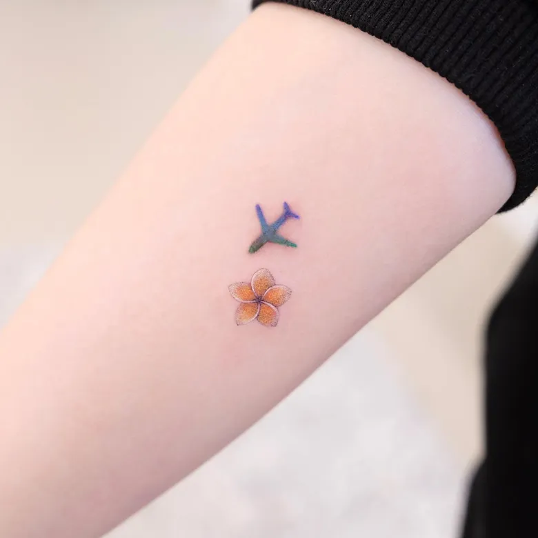 Airplane and Mini Plumeria Tattoo
