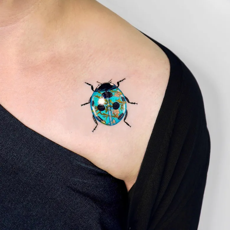 Almond Blossom Inspired Ladybug Tattoo