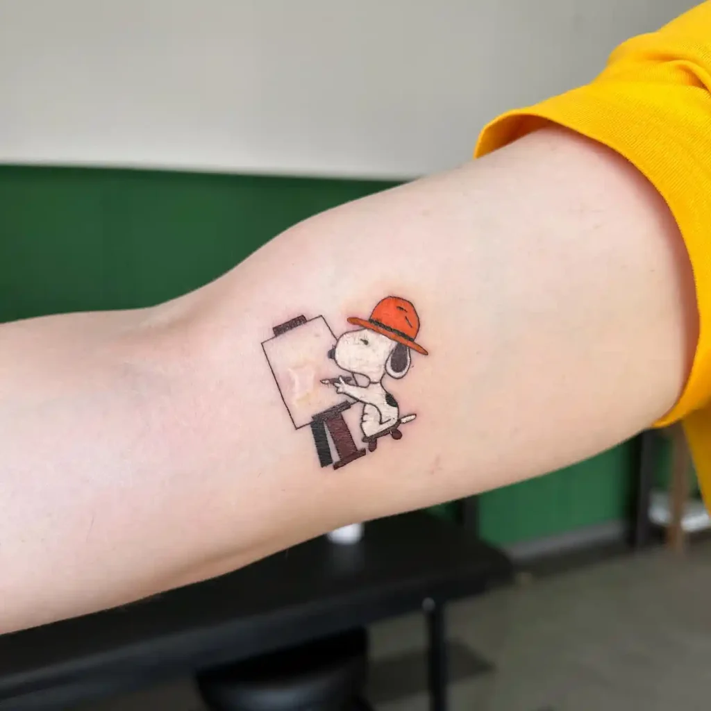 Artist Snoopy on Inner Arm