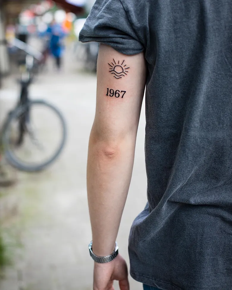 Birth Year Tattoo with Sun Symbol