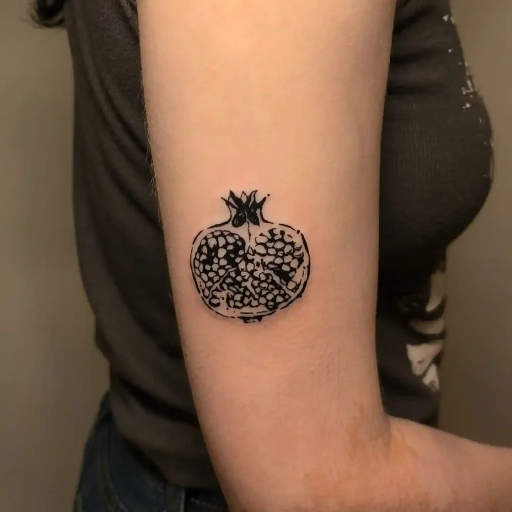 Black Ink Pomegranate on Upper Arm