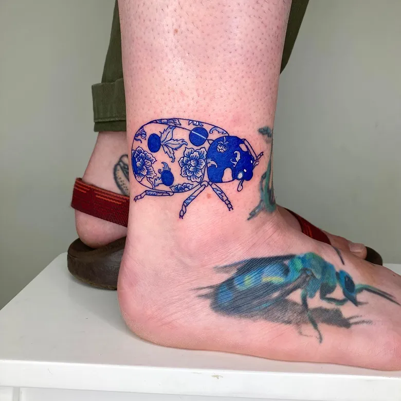 Blue Porcelain Ladybug Tattoo