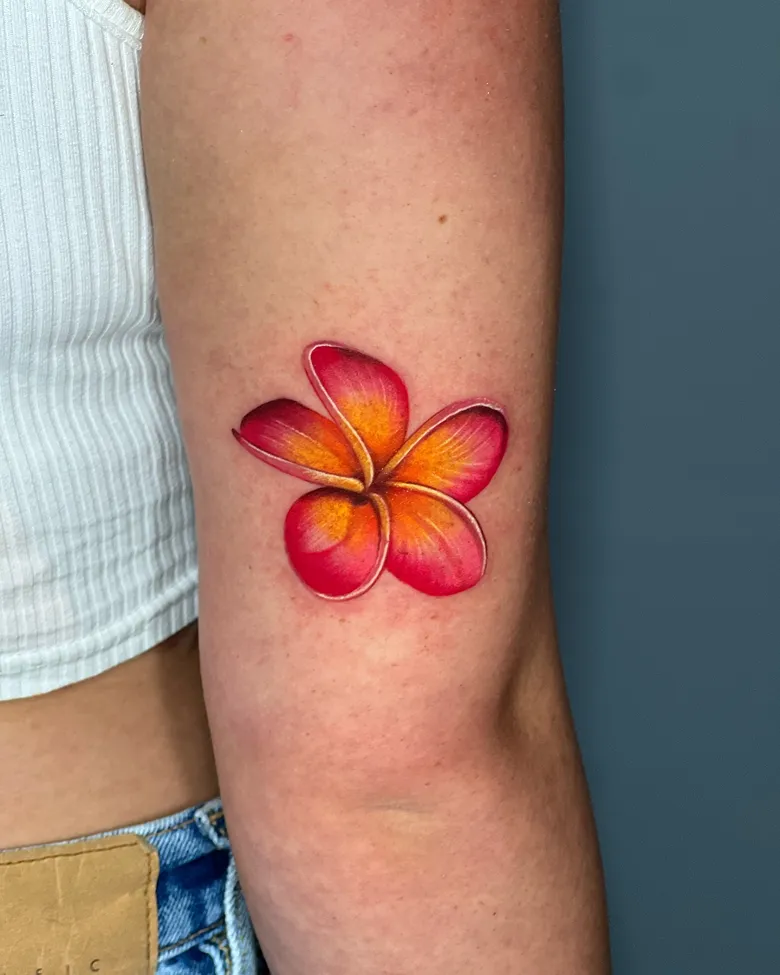 Bold Realistic Red Plumeria Arm Tattoo