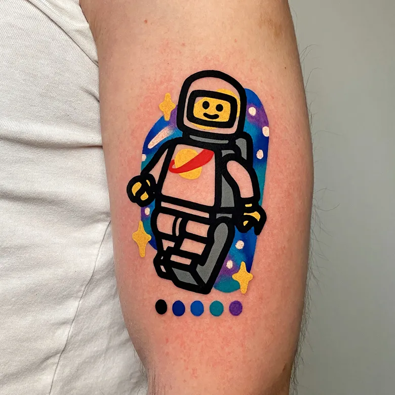 Cartoon Space Explorer Lego Tattoo