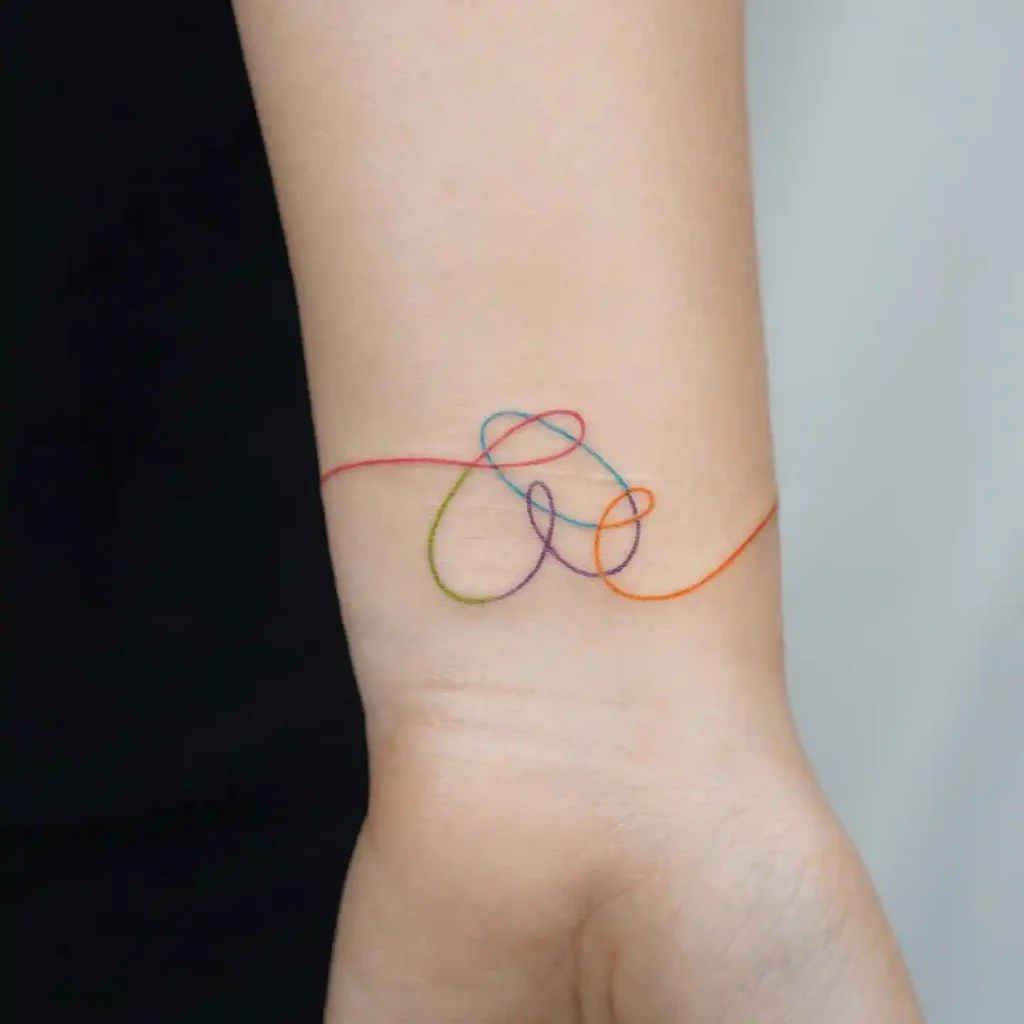 Colorful Threaded Heart on Inner Wrist
