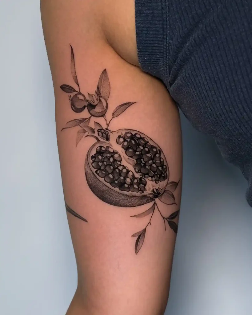 Cut Pomegranate Fruit on Inner Bicep