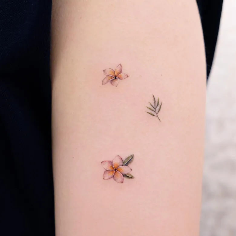 Delicate Scattered Plumeria Tattoo