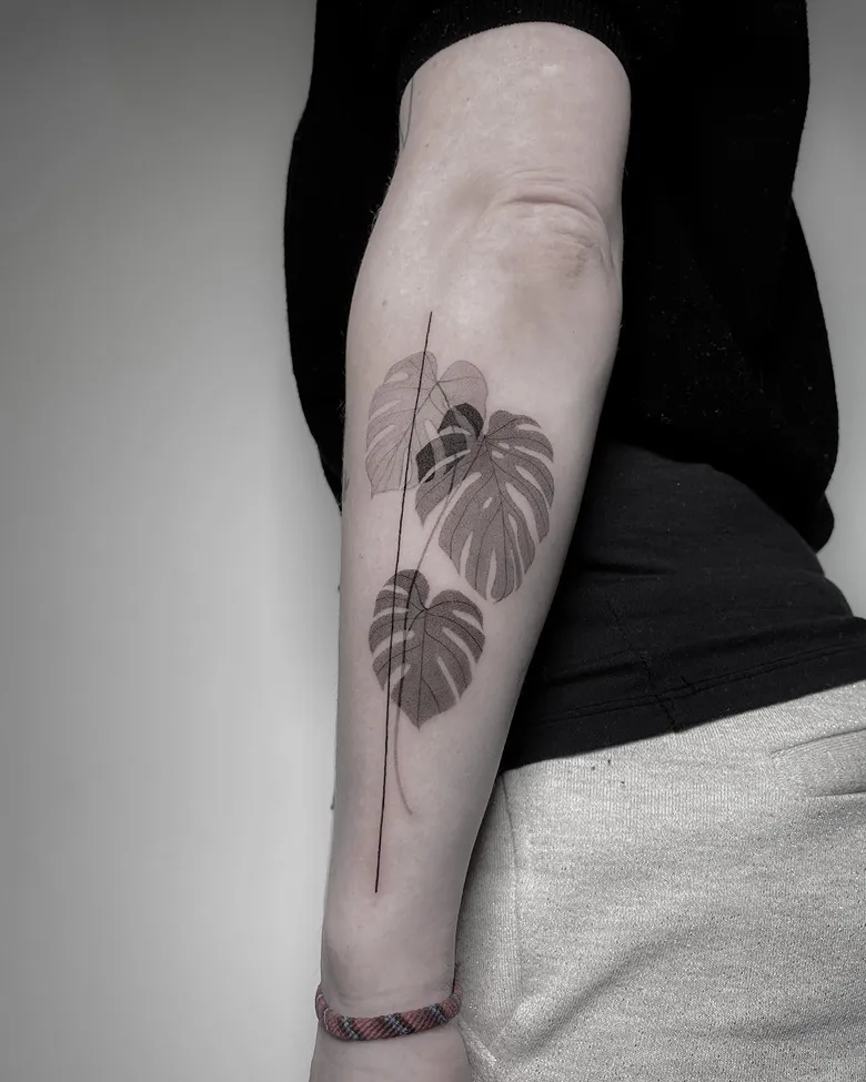 Elegant Fine Line Monstera Forearm Tattoo