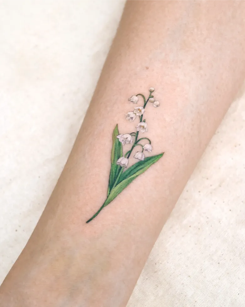 Elegant White Lily of the Valley Forearm Tattoo