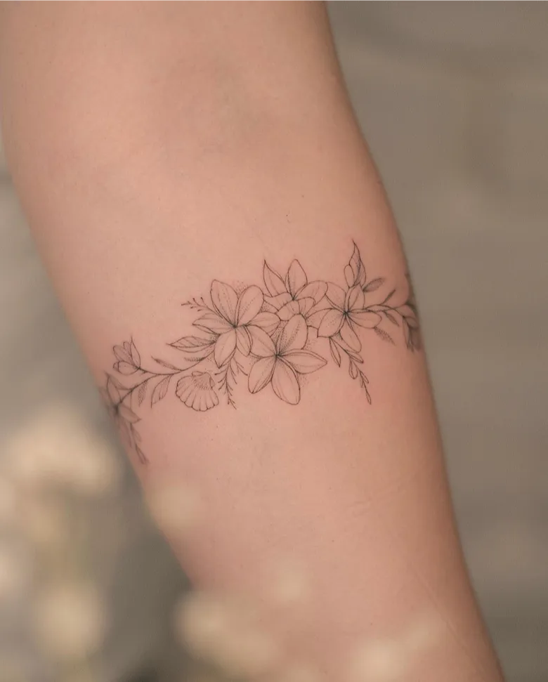 Fine Line Plumeria Bracelet Tattoo
