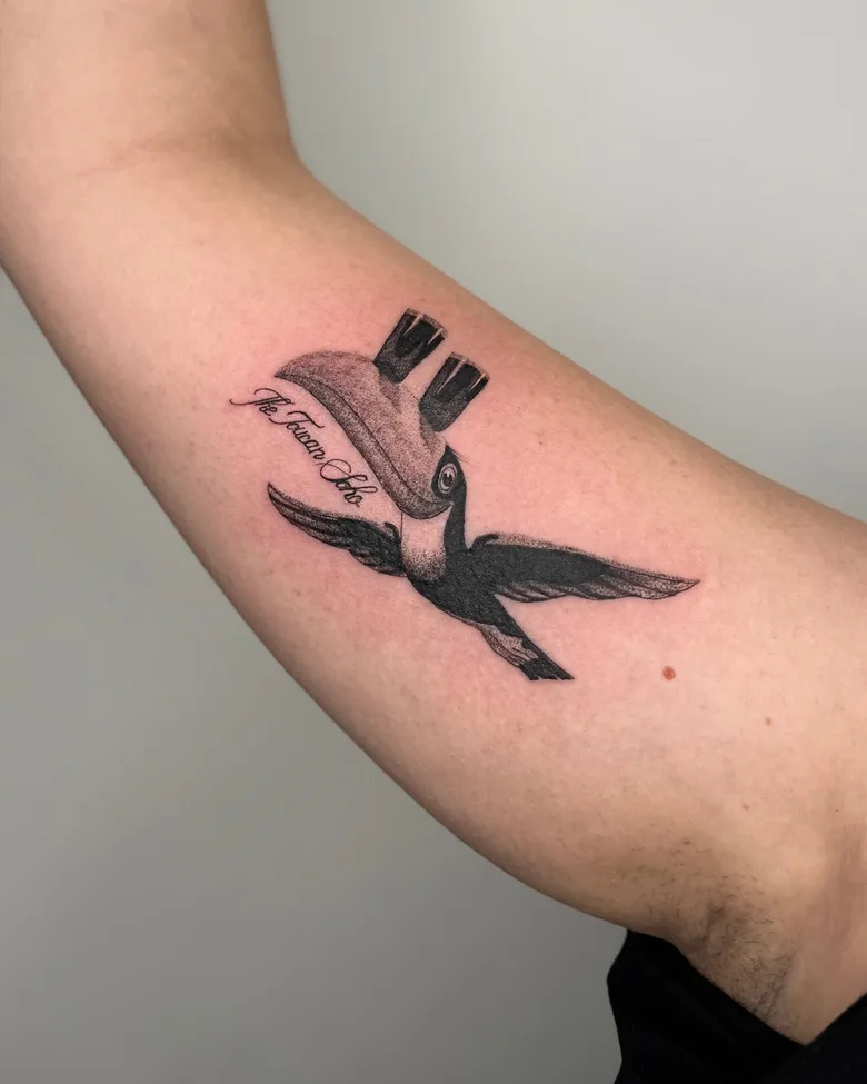 Fine Line Toucan With Guinness Beer Tribute Tattoo