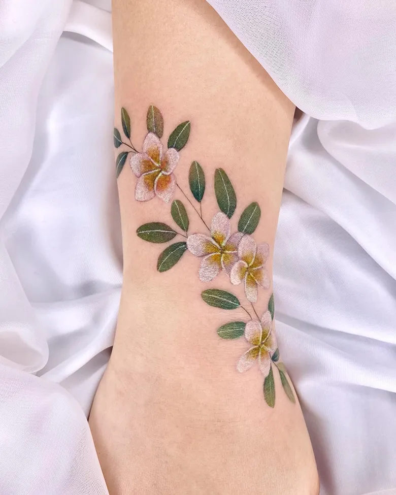Flowing Ankle Plumeria Vine Tattoo