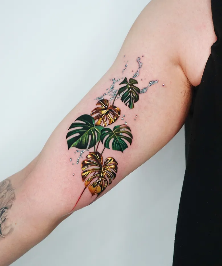 Glossy Green and Gold Monstera Tattoo