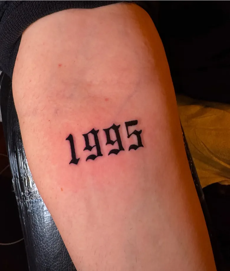 Gothic 1995 Birth Year Tattoo on the Leg